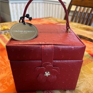 Cynthia Rowley Red faux leather Jewelry Case with Floral Accent.